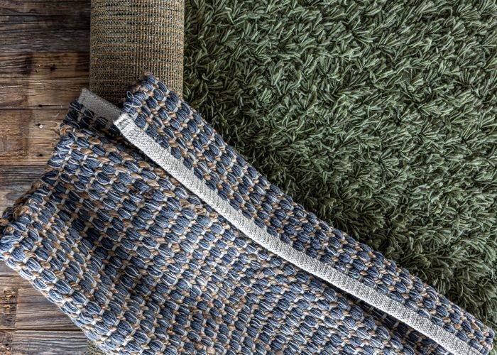 hand-woven-geometric-denim-area-rug-wooden-floor